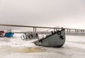 Ship wreck in a frozen river Royalty Free Stock Photo