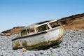 Ship wreck of an old boat washed up on a rocky beach