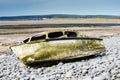 Ship wreck of an old boat washed up on a rocky beach