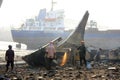 Shipbreaking Yard in Darukhana, Mumbai, India Ã¢â¬â INS Vikrant dismantling with scrap metal & workers in background Royalty Free Stock Photo