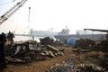 Shipbreaking Yard in Darukhana, Mumbai, India Ã¢â¬â INS Vikrant dismantling with scrap metal & workers in background