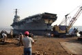 Shipbreaking Yard in Darukhana, Mumbai, India Ã¢â¬â INS Vikrant dismantling with scrap metal & workers in background