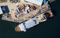 Shipbuilding construction ship aerial view at shipyard harbour with scaffold