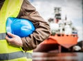 Shipbuilding engineer with safety helmet in shipyard