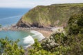 Shipload Bay on Devon`s coast with waves rolling in