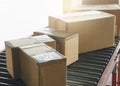 Shipment boxes. Packaging Cardboard boxes sorting on conveyor belt in distribution warehouse. Royalty Free Stock Photo