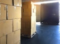 Shipments boxes on pallet waiting for load into container truck at warehouse dock. Royalty Free Stock Photo