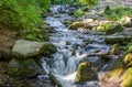 Shipot waterfall on a mountain river among stones and rocks in the Ukrainian Carpathians Royalty Free Stock Photo