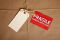 A Shipping box with a blank tag and a Fragile Royalty Free Stock Photo