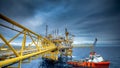 Rig platform and Supply vessel in the gulf Royalty Free Stock Photo