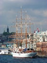 Shipping concept. Very beautiful big ship with masts and sails, in the port. Sea transport Royalty Free Stock Photo