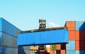 Shipping container loading by richtracker at International ship logistic terminal. Cargo sea containers in warehouse port.