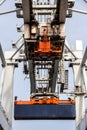 Shipping container unloaded by gantry crane from a industrial ship in the port Royalty Free Stock Photo