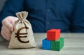 Shipping containers and euro money bag. Profit from sales of goods.