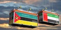 Shipping containers with flags of Mozambique and United Arab Emirates