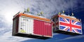 Shipping containers with flags of Qatar and United Kingdom