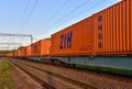 Shipping containers of ZIH Zhengzhou International Hub transportation on cargo train by railway. China-Europe freight trains.