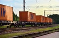 Shipping containers of ZIH Zhengzhou International Hub transportation on cargo train by railway. China-Europe freight trains.