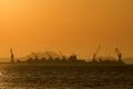 Shipping port in the sea with sunset sky Royalty Free Stock Photo