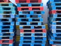 shipping receiving palate wood stacked palates trucking logistics wooden painted blue cargo generic strong support rack warehouse