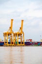 Shipping trade port. Container cargo ship loading or unloading by crane bridge. Royalty Free Stock Photo