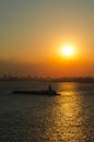 Shipping vessel in the sunrise in NYC
