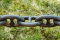 Ships anchor chain on the floor after painting Royalty Free Stock Photo