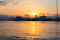 Ships and boats in harbour at sunset at the Greek island of Evia Royalty Free Stock Photo