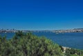 Ships and boats sail in the blue water of the Bosphorus. Royalty Free Stock Photo