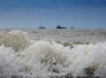 Ships and boats wait out the excitement of the high seas