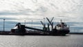 Finnish ship in the cargo port during cargo operation. Ship working on gasoil