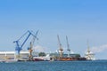 Ships and cranes Warnemunde port Royalty Free Stock Photo