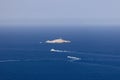 Ships cross the waters of Tyrrhenian Sea between the islands of the Tuscan archipelago