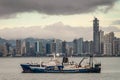 2 ships in front of City skyline cloudscape, Panama City, Panama