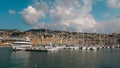 Ships in Genova port, Genoa seaport in Italy, under the blue sky with fluffy clouds