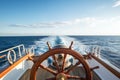 ships helm with ocean horizon in the background