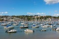 Ships moored in Dartmouth harbour with Britannia Royal Naval College in the background, Devon, England, UK Royalty Free Stock Photo