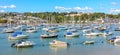 Ships moored in Dartmouth harbour with Britannia Royal Naval College in the background, Devon, United Kingdom Royalty Free Stock Photo