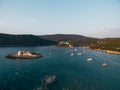 Ships are moored near the island of Otocic Gospa. Montenegro. Drone