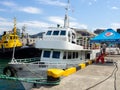 Ships in the port bay. Fishing trailer. Sea transport. Industry. In the Black Sea port. Batumi. The tugboat is moored in the