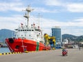 Ships in the port bay. Fishing trailer. Sea transport. Industry. In the Black Sea port. Batumi. The tugboat is moored in the