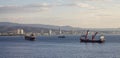 Ships at the Port and Modern Cityscape on the Sea Coast. Limassol, Cyprus Royalty Free Stock Photo