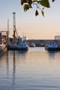 Ships with reflection in harbour at sunrise Royalty Free Stock Photo