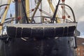 The Ships Tender and Lifeboat in the Davits of the stern of the Dutch historical Steam Warship, the HNLMS Bonaire Royalty Free Stock Photo