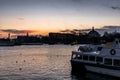 Ships, towers and bridges in the harbor of  Stockholm during a colorful sunrise in winter   - 1 Royalty Free Stock Photo