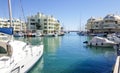 Ships and white luxury apartments in Marina Bay Benalmadena, Spain