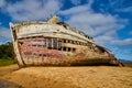 Shipwreck falling apart on sandy beaches on west coast
