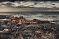 Shipwreck on a lava beach during storm Royalty Free Stock Photo