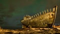 A shipwreck near the sea in the North of Iceland with nothern lights above