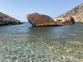 Shipwreck Olympia boat in Amorgos island during summer holidays, at the coastal rocky area, Cyclades, Greece. Travel background